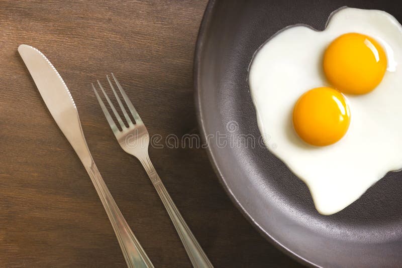 Fried Eggs With Knife And Fork Stock Photo Image of cuisine, omelet