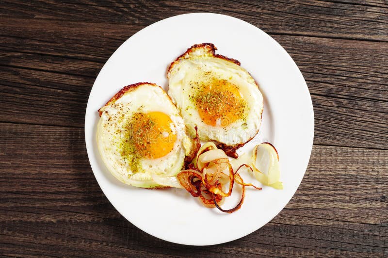 Fried eggs with onion stock image. Image of onion, bistro 61280003
