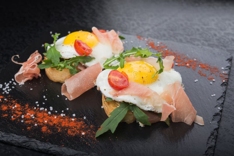 Fried Eggs with Prosciutto and Arugula Stock Photo Image of avocado, fried 80608228