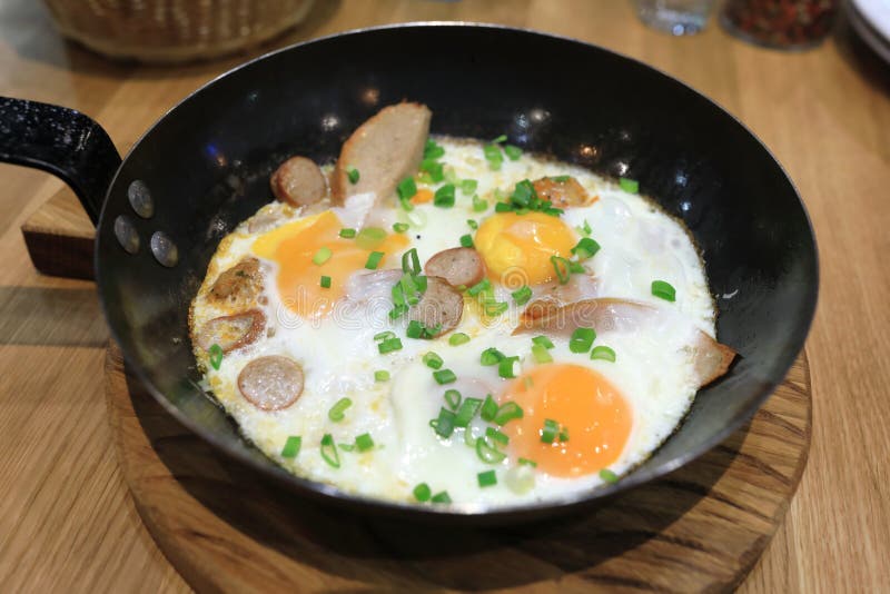 Fried eggs with sausages stock image. Image of fried 20609763