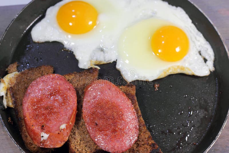 Fried eggs stock photo. Image of lunch, sausage, food 63438400