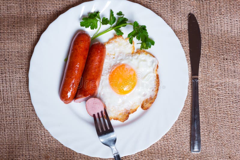 Fried eggs and sausage stock image. Image of sausage 51150151