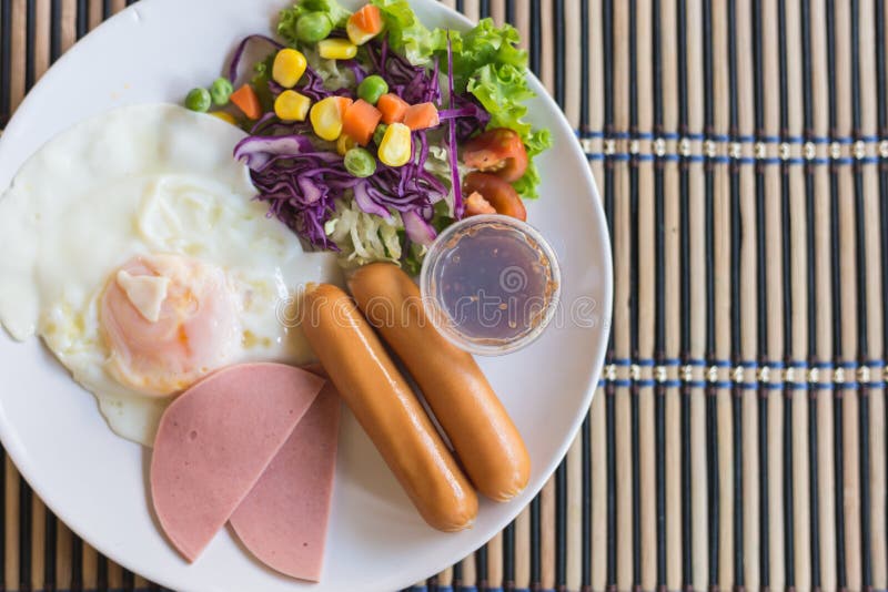 Fried Eggs, Sausages, Ham and Mix Vegetable on Dish Stock Image Image