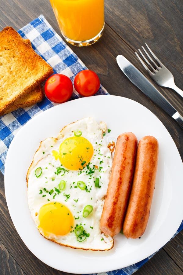 Fried eggs with sausages. stock image. Image of nutrition 34040091