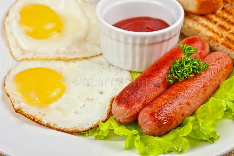 Fried eggs with sausages stock image. Image of pork, menu 33479927