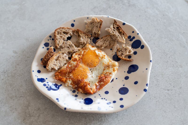 Fried Eggs with Sesame, Served with Sour Dough Toast Stock Photo