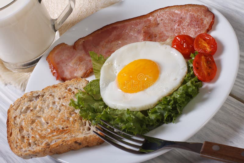 Fried Eggs with Vegetables, Bacon and Milk Stock Image Image of glass