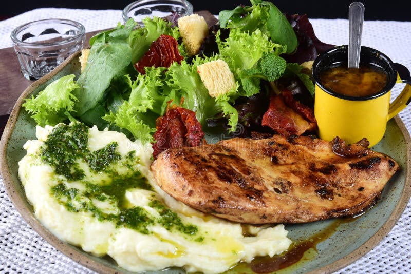 Fried Fish Fillet with Boiled Mashed Potatoes and Salads Stock Image