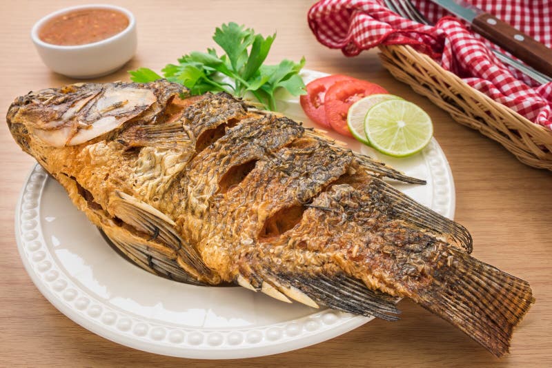 Fried fish on white plate and dip sauce