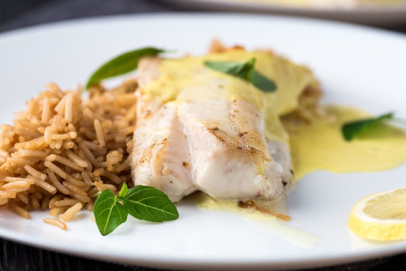Grilled Fish with Rice and Lemon Sauce Stock Photo Image of sauce
