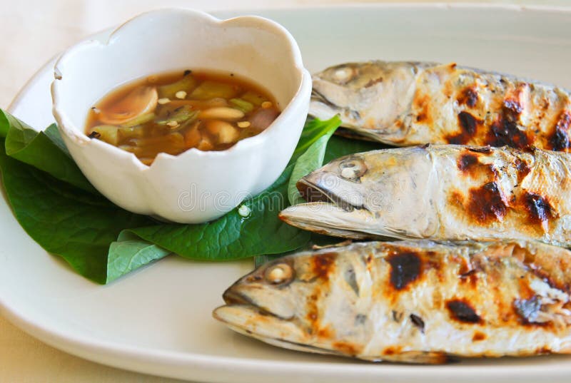 Fried mackerel with spicy sauce stock images