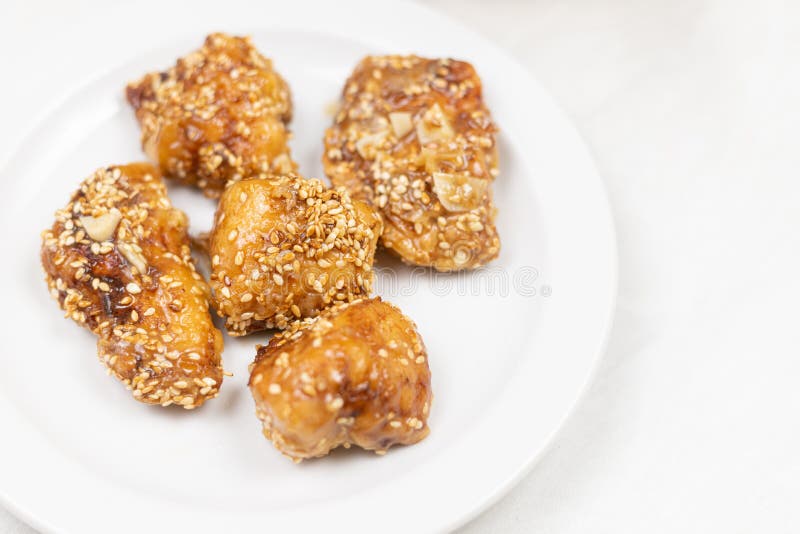 Fried Marinated Chicken White Meat on the White Plate Stock Photo