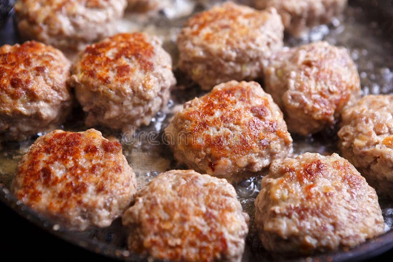 Fried Meat Patties are Cooked in a Pan in the Oil in the Kitchen Stock