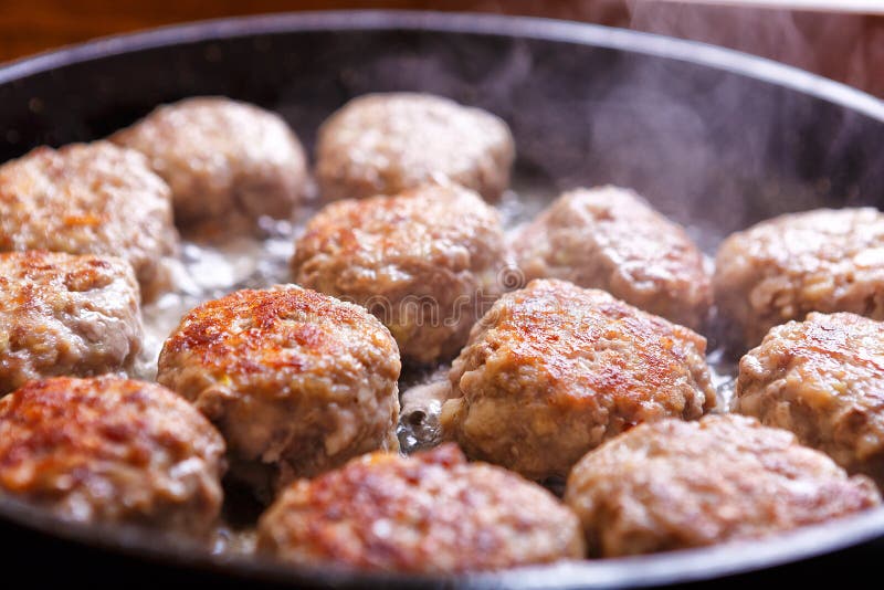Fried Meat Patties are Cooked in a Pan in the Oil in the Kitchen Stock
