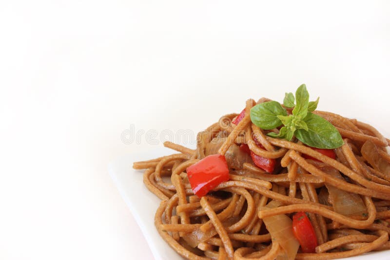 Fried noodles with vegetables and basil