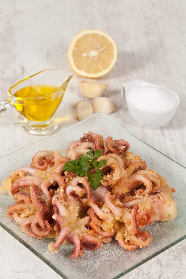 Fried Octopus Tentacles with White Rice on a Plate, Close Up Stock