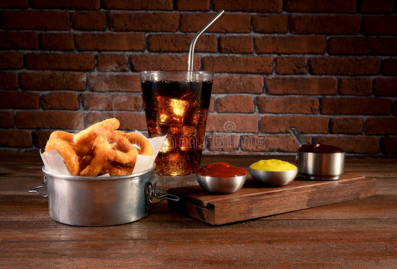 Fried Onion Rings with Ketchup, Mustard and Barbecue Stock Image