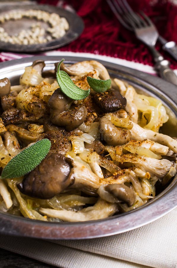 Fried Oyster Mushrooms with Onions Stock Photo - Image of pepper ...