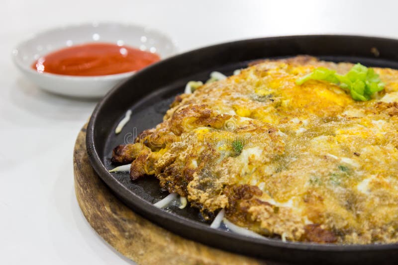 Fried Oysters with Egg and Flour Chilli Sauce on Hot Plate Stock Image
