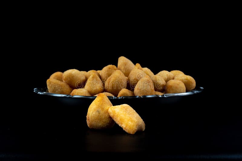 Fried Party Snacks Arranged on a Stainless Steel Plate with Black