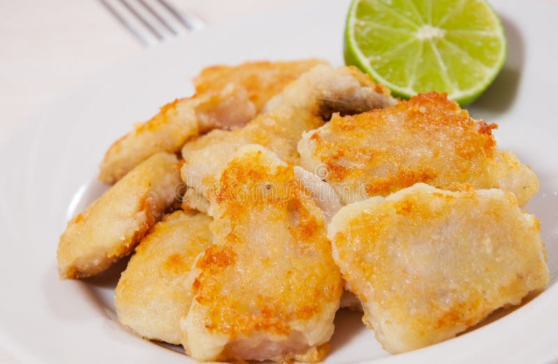 Fried pieces of fish fillets royalty free stock photos