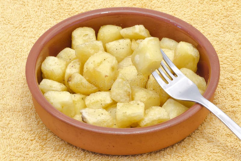 Fried pieces of potatoes royalty free stock photo