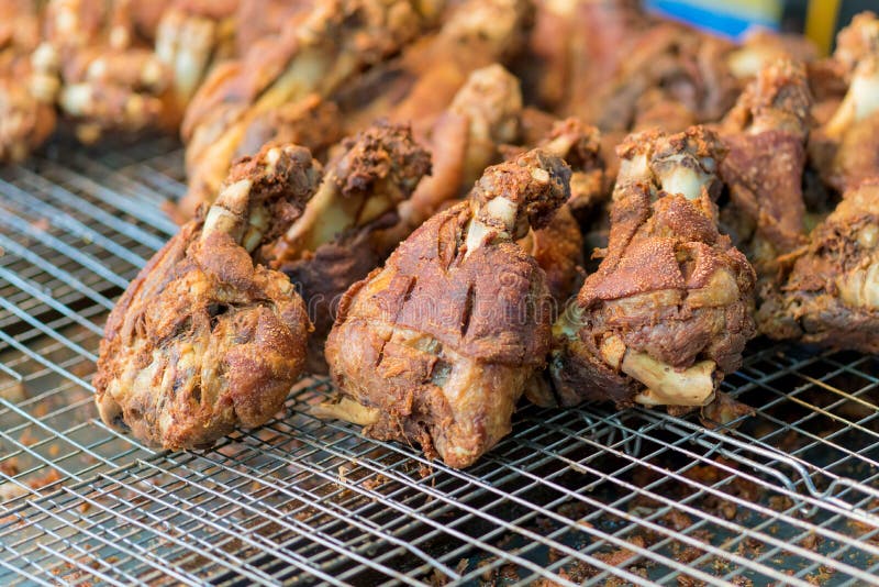Fried Pork Leg Knuckle Cooked in Thai Style at the Market Stock Photo