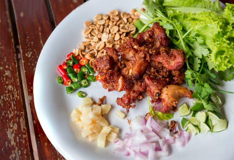 Fried Pork Rib Served With Side Dish Of Garlic, Chilli And ...
