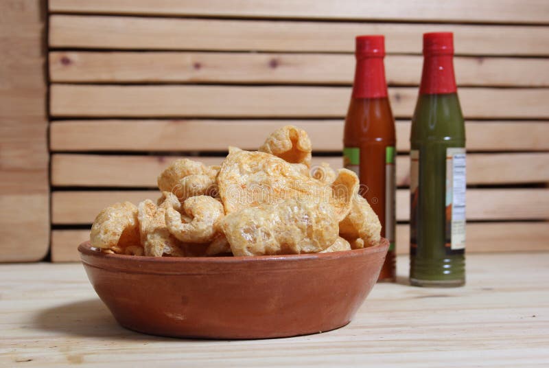 Fried Pork Skins with Hot Sauce in Rustic Kitchen Stock Image Image