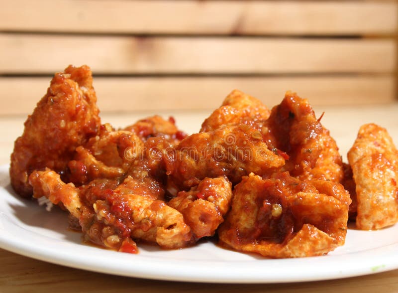 Fried Pork Skins with Red Salsa in Rustic Kitchen Stock Photo - Image ...