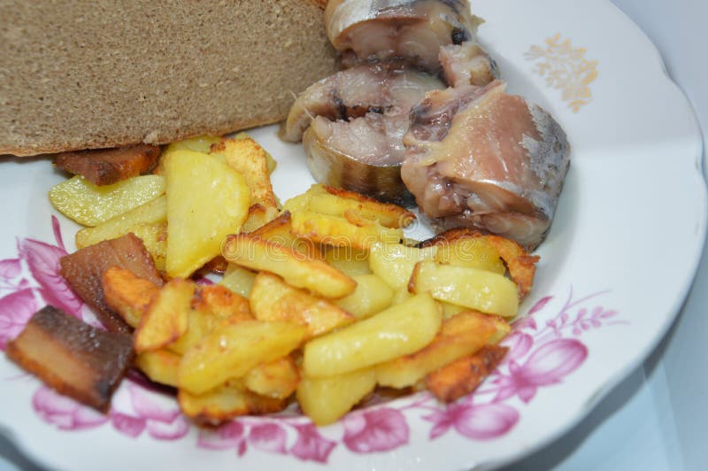 Fried Potato Dish with Cold Smoked Fish and Bread Stock Photo Image