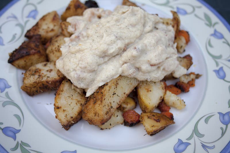 Fried Potato with Fresh Carrot with White Cauliflower Sauce. Stock