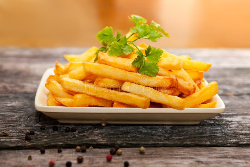 Fried potato with parsley stock image. Image of crispy 100663211