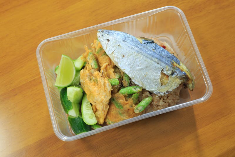Fried Rice with Mackerel Fish in a Plastic Box that Can Be Heated in