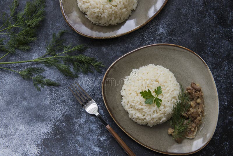 Fried Rice and Meat in Plate on the Table in Restaurant. Food