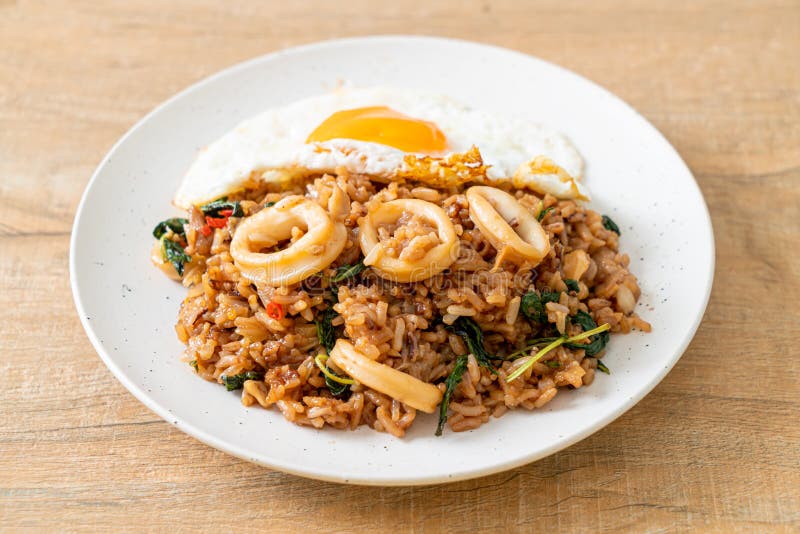 Fried Rice with Squid and Basil Topped Fried Egg in Thai Style Stock