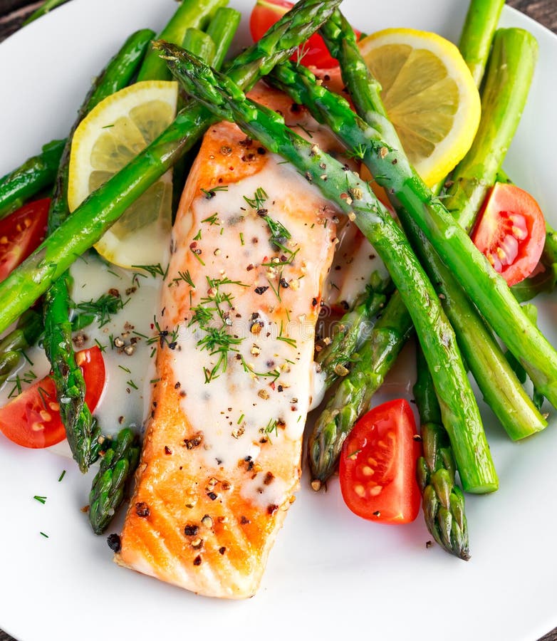 Fried Salmon with Asparagus, Tomatoes, Lemon, Yellow Lime on White ...