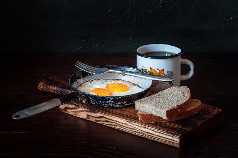 Fried Scrambled Eggs in Vintage Pan, with Bread, Old Fork, Metal Mug