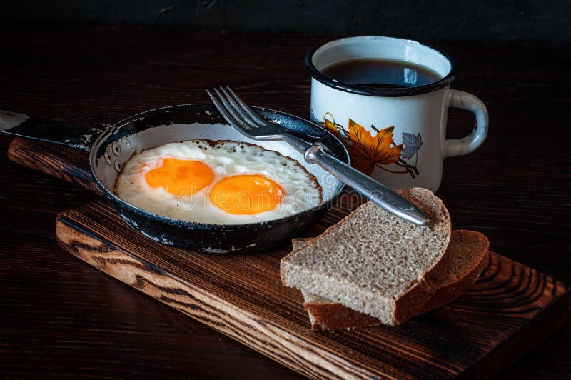 Fried Scrambled Eggs in Vintage Pan, with Bread, Old Fork, Metal Mug