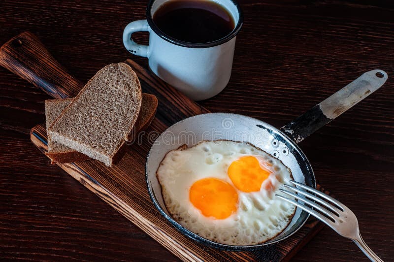 Fried Scrambled Eggs in Vintage Pan, with Bread, Old Fork, Metal Mug