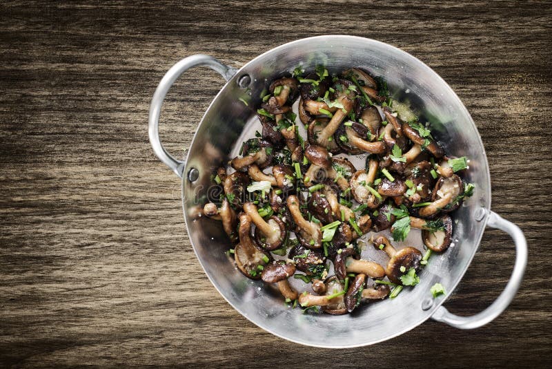 Fried shiitake mushrooms in garlic herb and olive oil snack