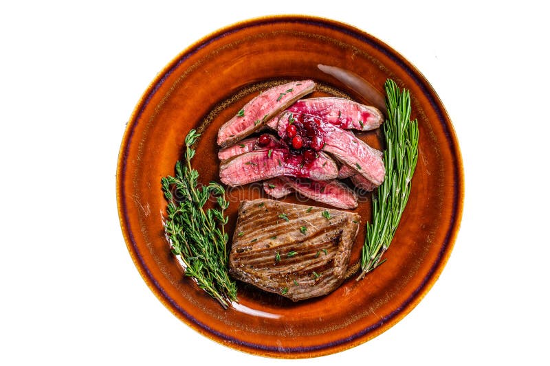 Fried Sliced Flank or Bavette Beef Meat Steak on a Plate. Isolated on White Background. Stock