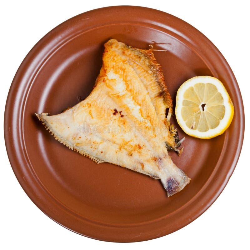 Fried sole fish on brown plate