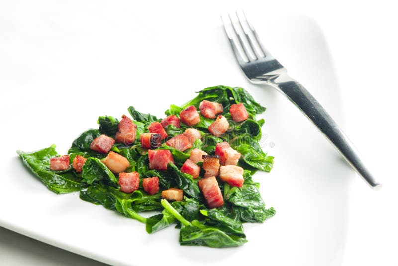 Fried spinach with bacon stock photo. Image of food - 240427646