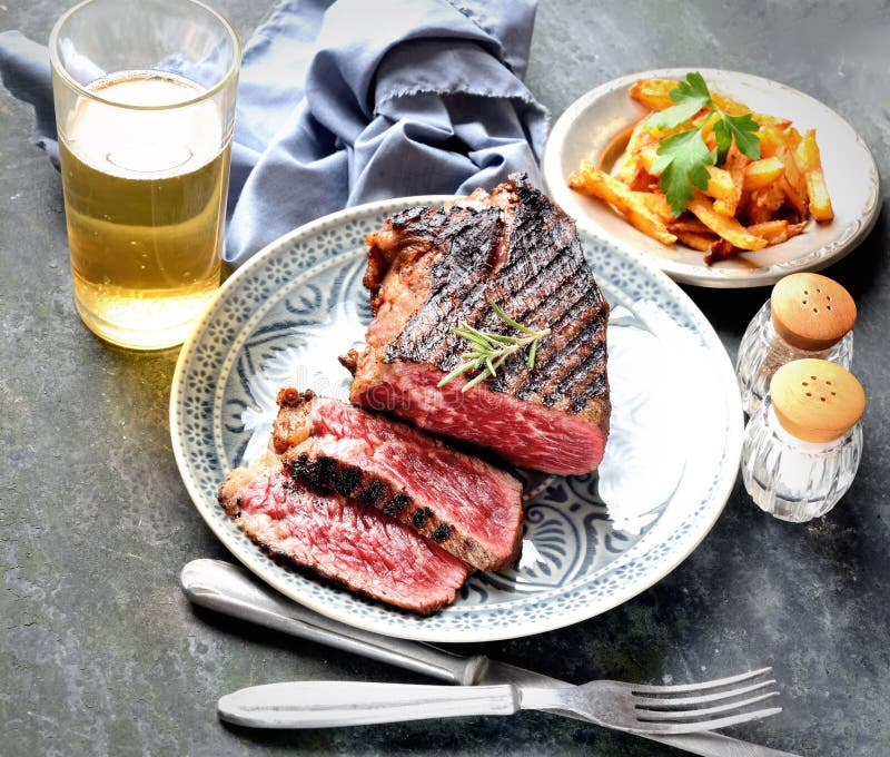 Fried Steak Rosemary Spices Beer Chips Fork Knife Dark Background Stock