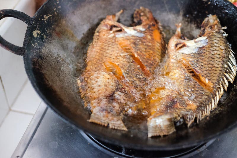 Fried Tilapia Fish With Oil In Pan. Stock Image Image of fried, closeup 138080509