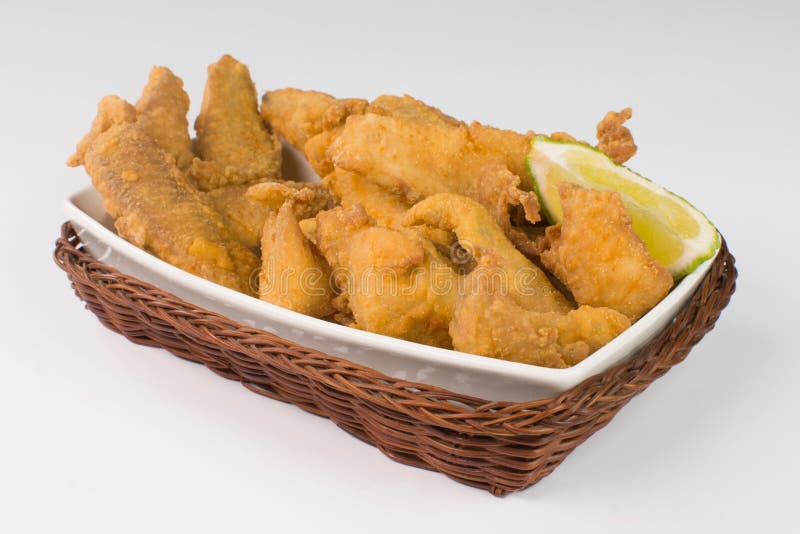 Fried Tilapia Strips in a Black Platter with Rose Pepper Sauce in