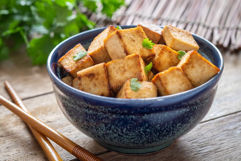 Fried tofu in bowl, Vegetarian food. Fried tofu in a bowl, Vegetarian food stock photo