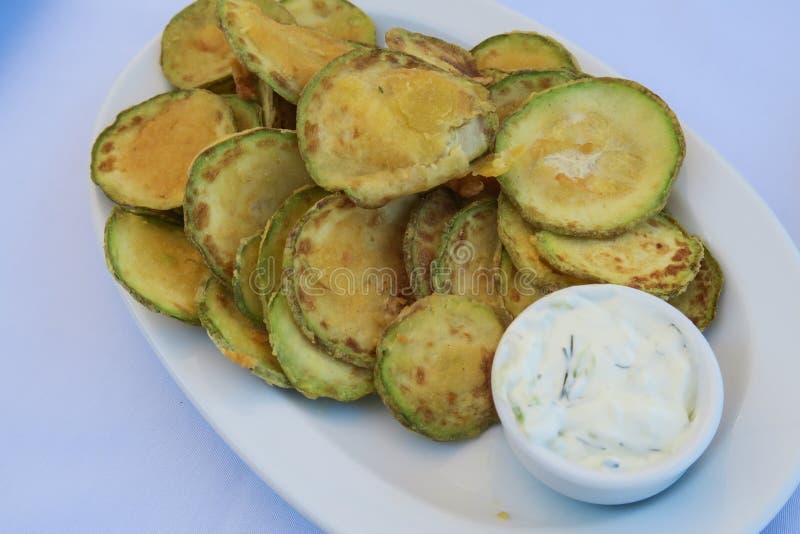 Fried zucchini chips with tzatziki Greek tavern plate.