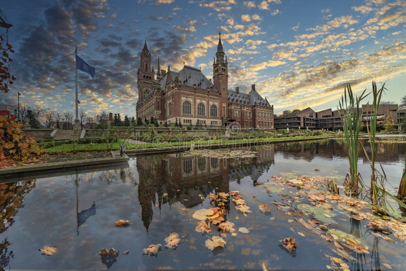 Autumn leafs falling on the Peace Palace pond, beautiful building and most visited building in The Hague, Netherlands. Autumn leafs falling on the Peace Palace pond, beautiful building and most visited building in The Hague, Netherlands